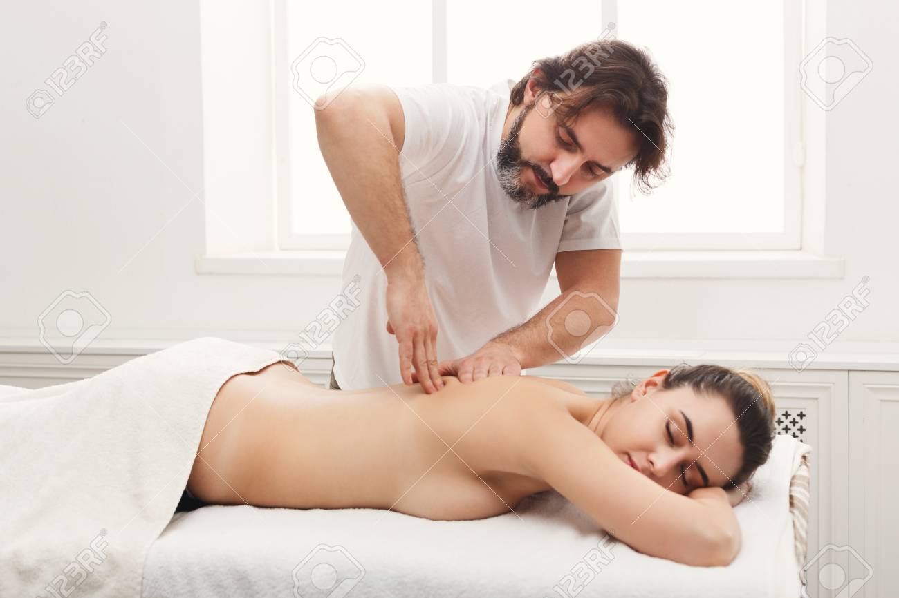 Therapist giving a relaxing back massage